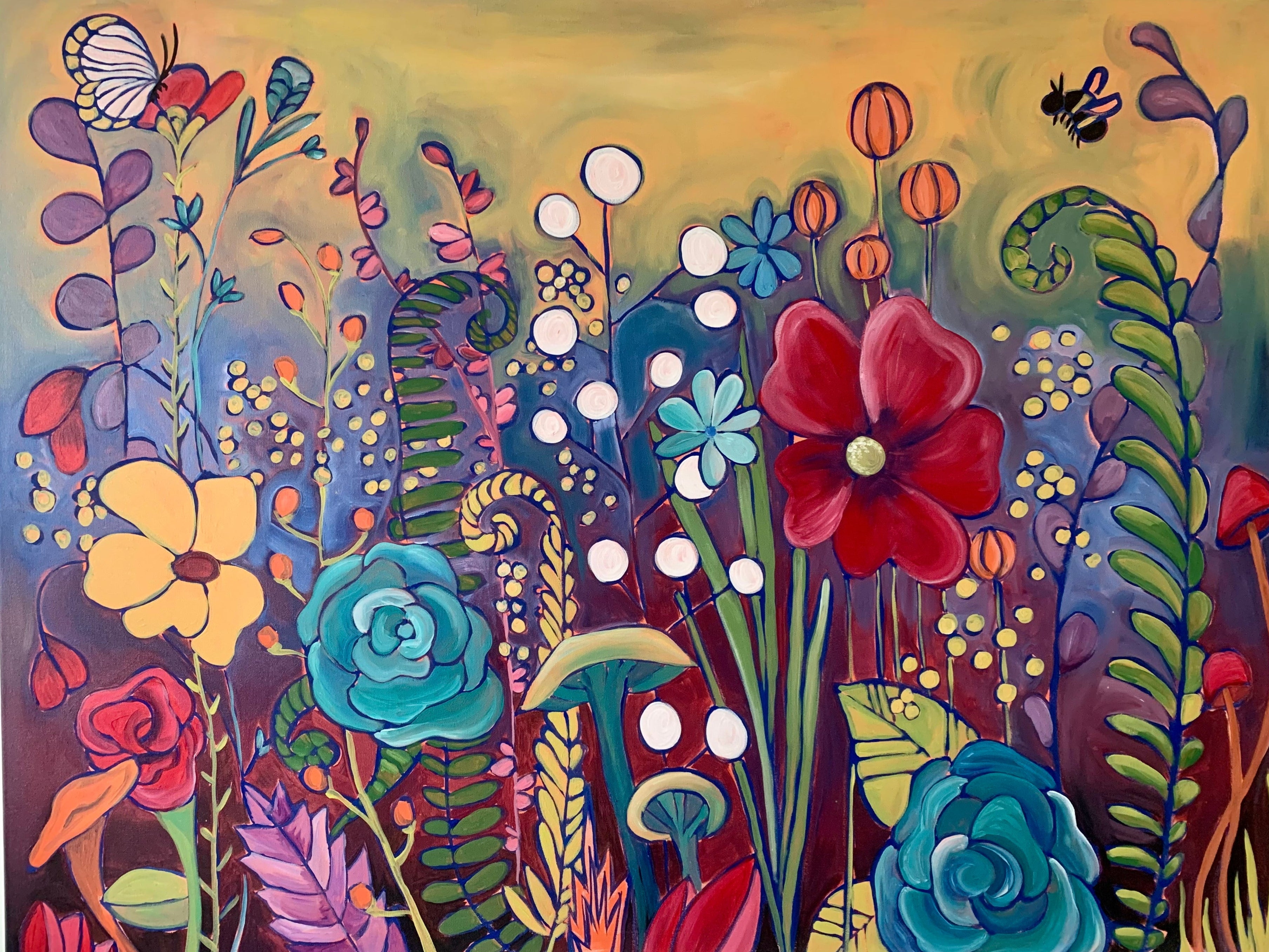 Colorful floral painting with various flowers and a butterfly on a wooden easel.